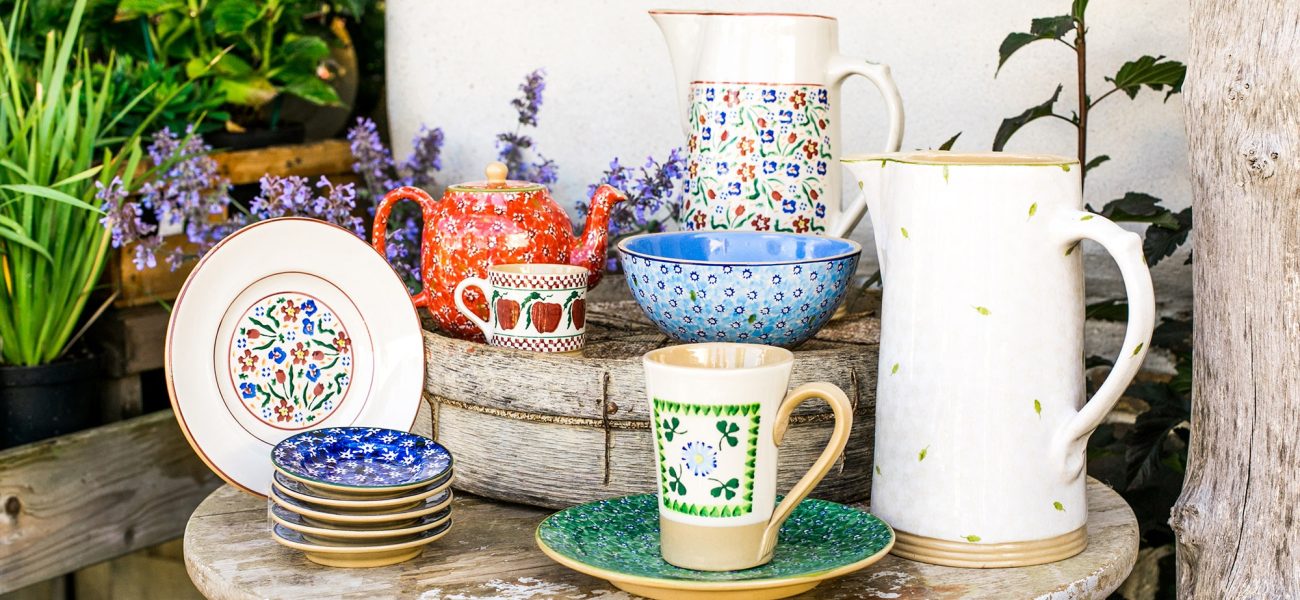 Collection of colourful pottery by Nicholas Mosse at Duchy Nursery.