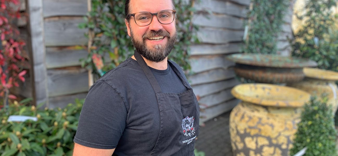 Picture of man with beard and glasses standing outside the Duchy of Cornwall Nursery.