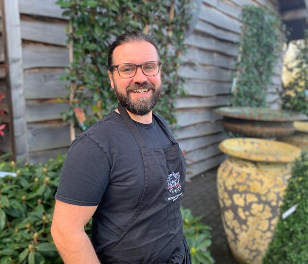 Picture of man with beard and glasses standing outside the Duchy of Cornwall Nursery.